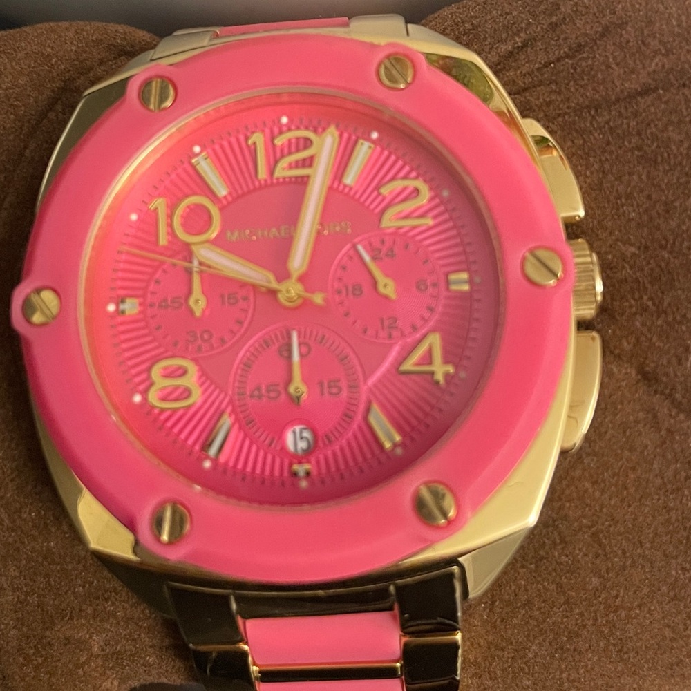 Micheal Kors hot pink with gold watch like New.